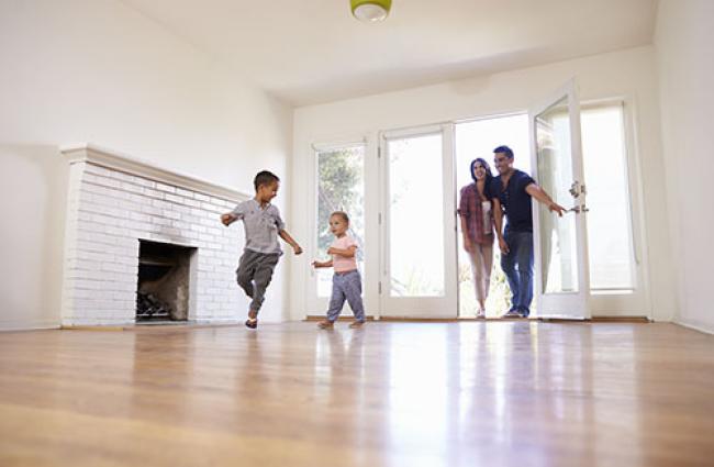 Family walking into a house