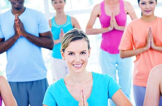 Group of people in yoga class