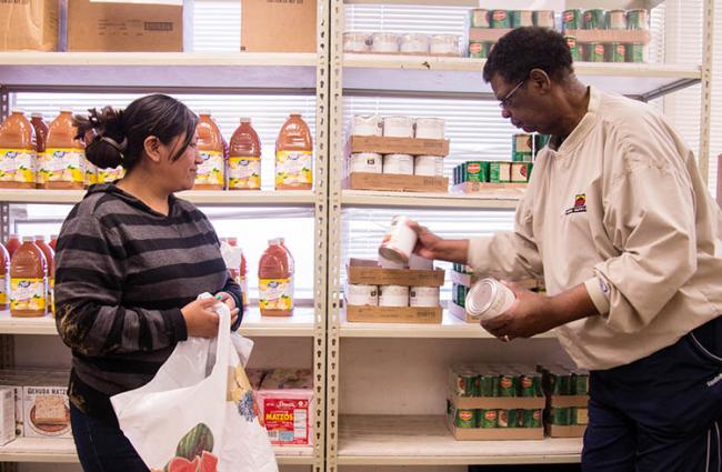 Image of two people at a food bank