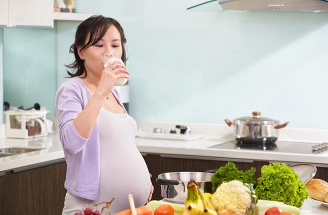 Woman drinking milk.