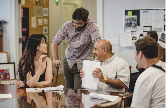 People sitting at a table, talking