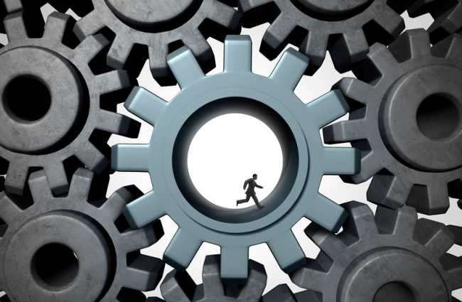Person running inside a cog surrounded by other cogs, representing the multidimensionality of systemic racism