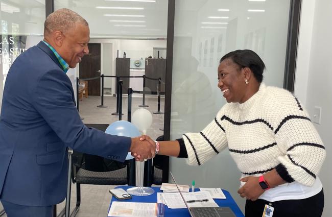 Omaha mayor, John Ewing, shakes hands with a BEAT Cancer team member at a Nebraska DMV