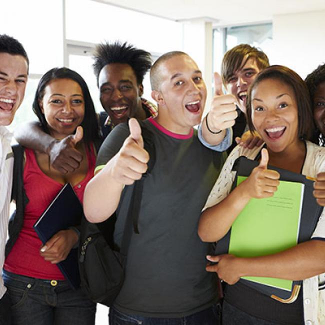 Group of people giving thumbs up