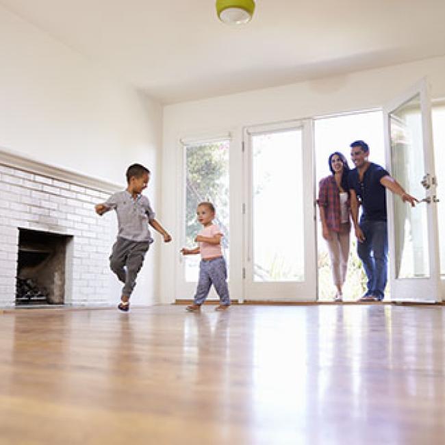 Family walking into a house