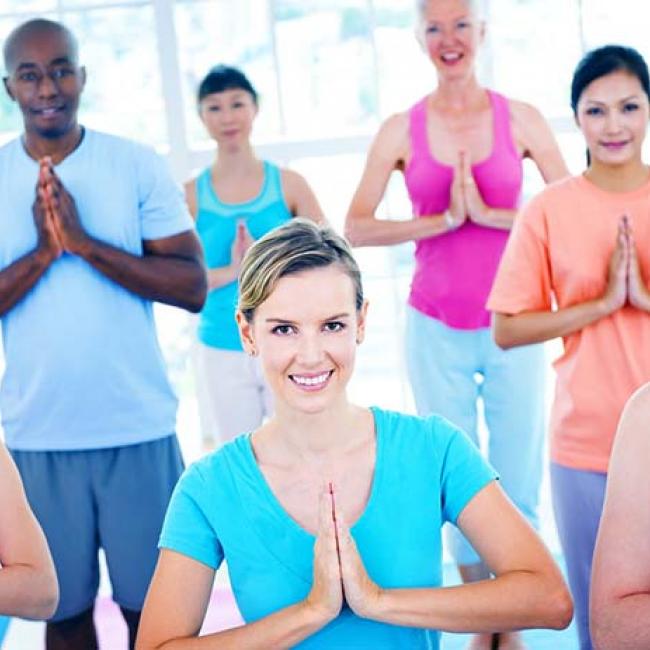 Group of people in yoga class