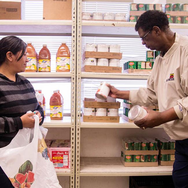 Image of two people at a food bank