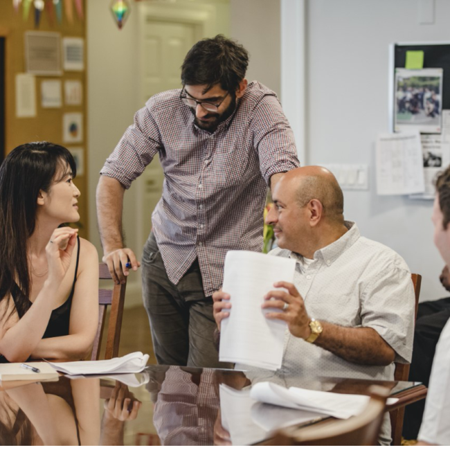 People sitting at a table, talking