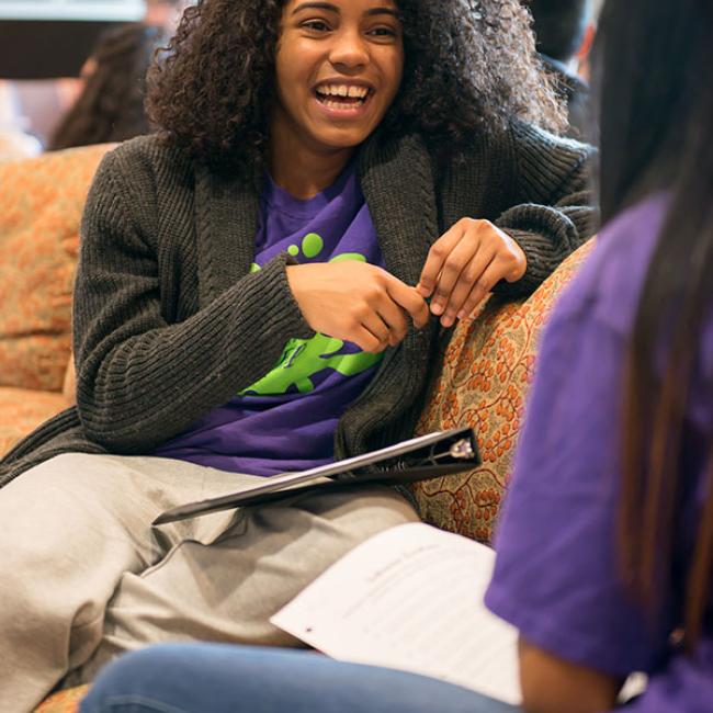 Students talking on a couch