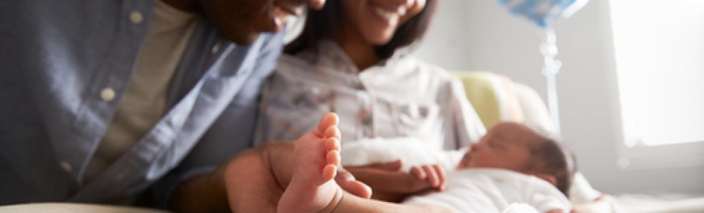 Parents looking at their newborn