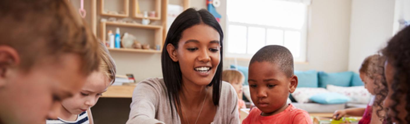 Teacher and pre-schoolers with arts & crafts