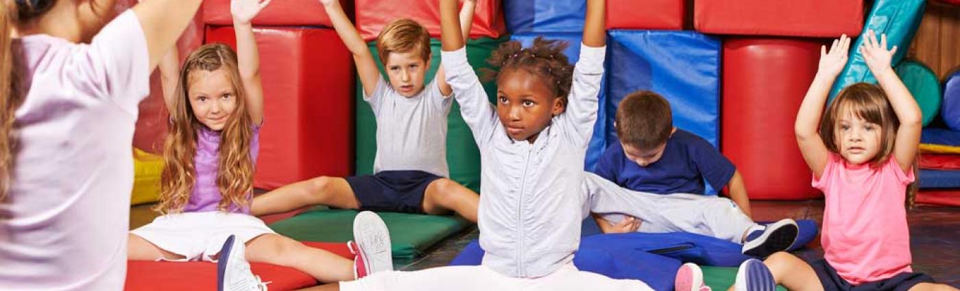 Image of children playing on mats.