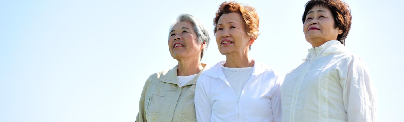 Asian woman threesome of elderly overlooking the sky